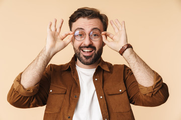 Portrait of a cheerful young arttractive bearded man