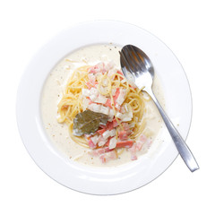 Spaghetti with ham in white plate in isolated