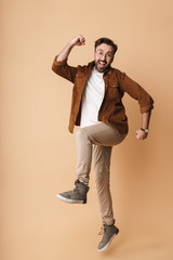 Fototapeta premium Portrait of a cheerful young arttractive bearded man