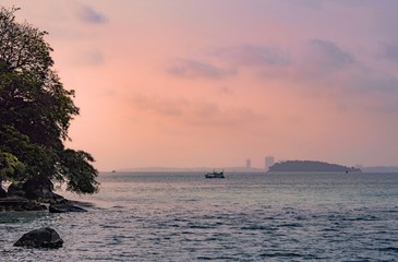 Fototapeta na wymiar Lonely boat on sunset background