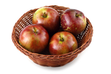 Apples on wicker plate