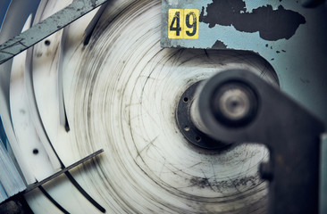 A industrial commercial envelope making machine, making paper envelopes for international distribution. Automated engineering machinery for mass production of paper envelopes.