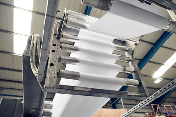 A toilet paper making machine producing toilet and bathroom paper rolls. Paper and tissue...