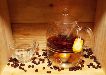 Coffee pot and cup with spread coffee beans decoration