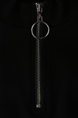 Fototapeta na wymiar Black jacket with silver clasp close up 