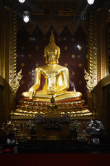 Buddha's statue in golden building at Mae Sot, Thailand