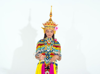 Fototapeta premium The beautiful woman wearing Thai Tradition southern costume and put headdress on her head,standing on white background,folk dance,black shadow reflection on white background