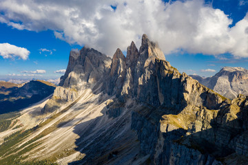 Drone view on Seceda peak. Trentino Alto Adige, Dolomites Alps, South Tyrol, Italy. Odle mountain range, Val Gardena. Majestic Furchetta peak. Odles group seen from Seceda, Santa Cristina Val Gardena.