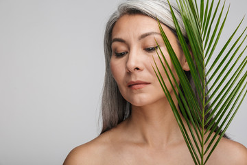 Beauty portrait of an attractive mature topless woman