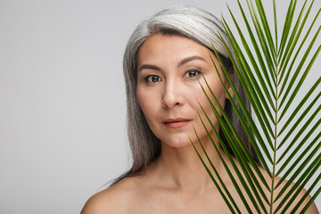 Beauty portrait of an attractive mature topless woman
