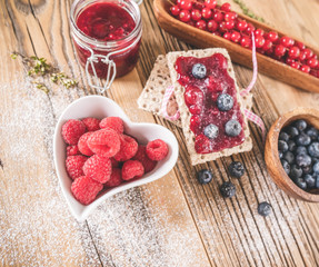 Raspberries with pastry appetizers blueberries. Focus on raspberry