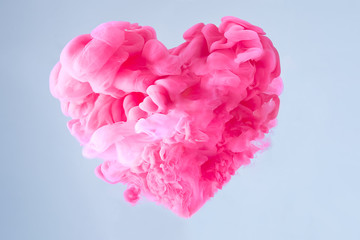Love is in the air. Pink Heart Shaped Cloud with blue background. Valentine's Day Concept