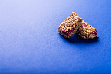 Muesli bar on a deep blue background