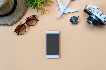 Top view of travel accessories  on orange color background, travel concept. Flat lay , copy space