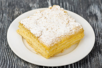 Puff cake from curd cheese with sweet tender filling with powdered sugar