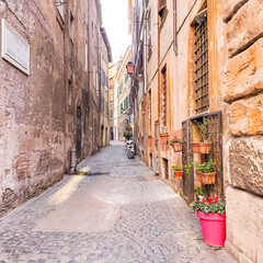 Fototapeta na wymiar ROME, ITALY - February 7, 2020: The cobbled streets. Old street in Rome, Italy. street view. Architecture and landmark of Rome