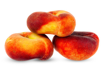 Fototapeta na wymiar Flat peaches, close-up on a white background.