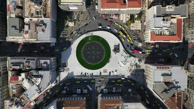 Aerial drone video of recently renovated fountain of famous round square of Omonia in the heart of Athens centre, Attica, Greece