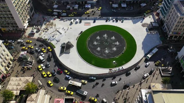 Aerial drone video of recently renovated fountain of famous round square of Omonia in the heart of Athens centre, Attica, Greece