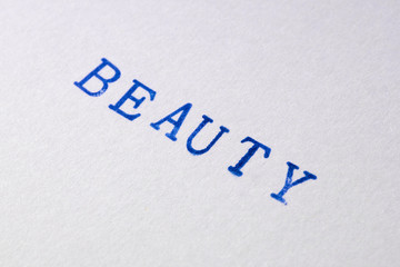 a beauty word stamped on a piece of paper.