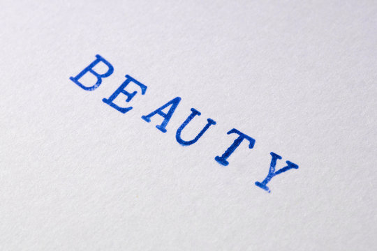 a beauty word stamped on a piece of paper.