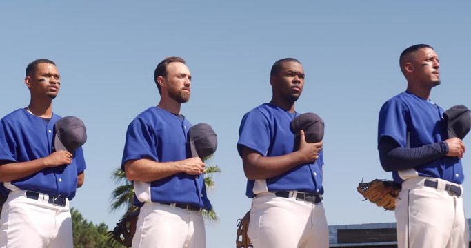 Baseball players standing on line