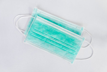 Disposable surgical face mask use for cover the mouth and nose, for protection against flu, corona virus(COVID-19) and other diseases on white background.