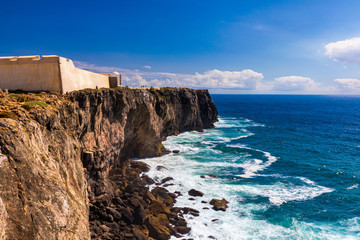 Portuguese coast, cliff into the Atlantic Ocean. Taken in Sagres, Faro, Algarve, Portugal. Beautiful coast of Portugal, Sagres.