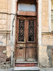 Old Tbilisi architecture, window and exterior decor in summer day.