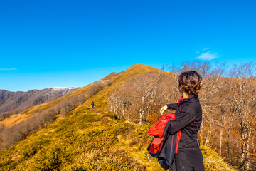 A young woman climbing Mount Ekaitza in Navarra