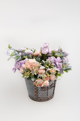 plastic flower in the iron bascet  on the white background