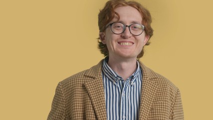 New fluid identity male portrait redhead authentic man in glasses laughing wears a vintage clothes. 