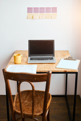 working place concept. stickers are hanging on the wall, close up photo