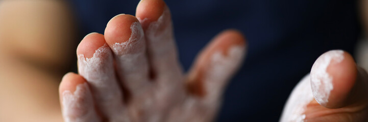 Male hands smeared with magnesium powder ready to workout