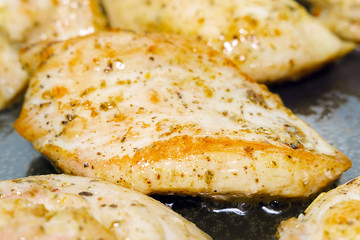 Roasted chicken pieces extreme close-up macro