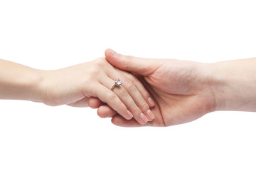 Ring with a stone on her hand. Male hand holds a female hand on a white background. Body parts.