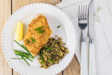 Fried light breaded cod fish.