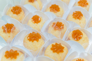 Top view of delicious coconut candies icing caramel.