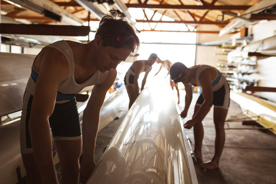 Teammates putting down the boat
