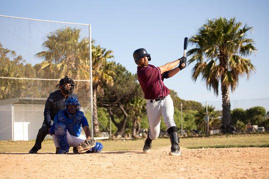 Baseball player hitting a ball during a match