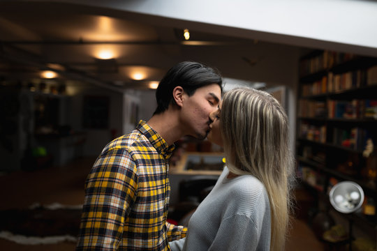 Young couple kissing while standing