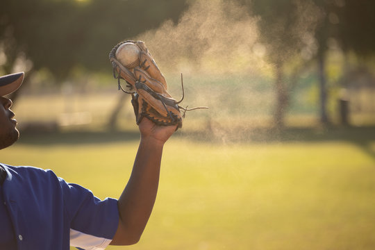 Baseball Player Catching A Ball During A Match