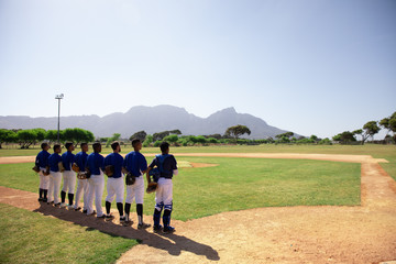 Baseball players standing on line