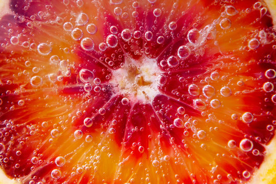 Blood-orange Cocktail. Selective Focus. Juicy Ripe Fruit In Water. Close Up