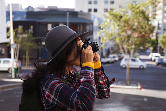 Woman taking picture on the street
