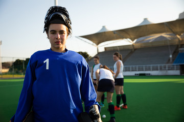 Female hockey goalkeeper looking at the camera
