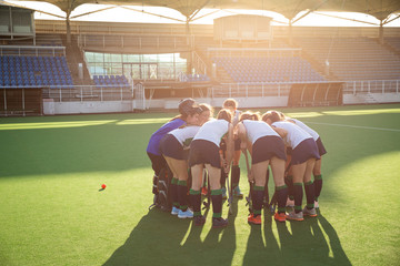 Female hockey players preparing match on the field