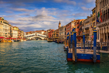 Fototapeta na wymiar Rialto bridge in Venice, Italy. Venice Grand Canal. Architecture and landmarks of Venice. Venice postcard with Venice gondolas