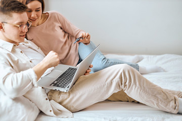 young excited people checking finance on credit card. bank, close up side view photo, family learning options with credit card