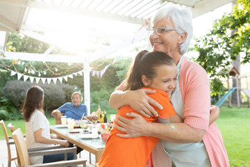 Family eating outside together in summer